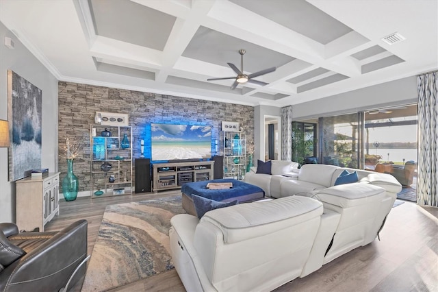 living area featuring beam ceiling, a ceiling fan, wood finished floors, visible vents, and coffered ceiling