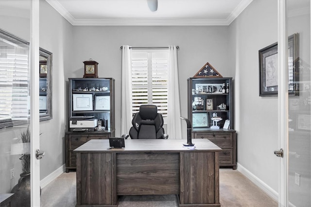 home office featuring crown molding, baseboards, and light colored carpet
