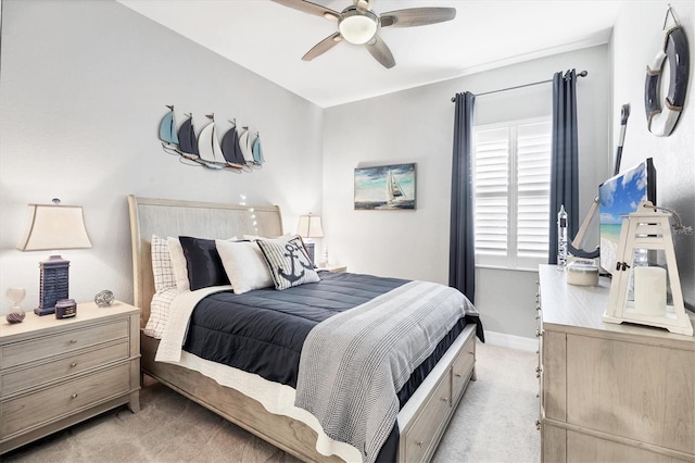 bedroom with baseboards, ceiling fan, and light colored carpet