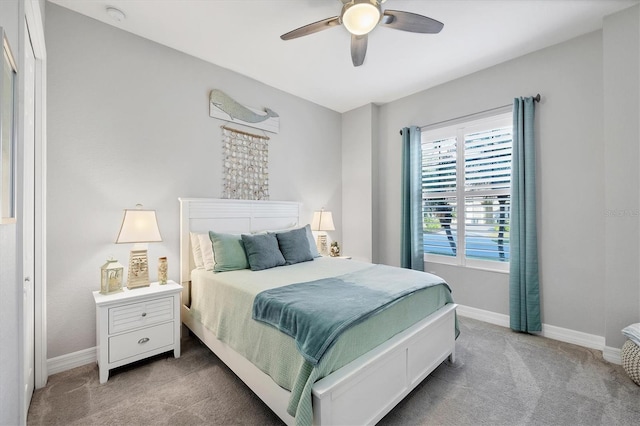 carpeted bedroom with baseboards and ceiling fan