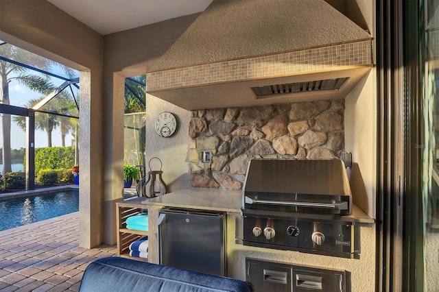 view of patio featuring a lanai, a grill, area for grilling, and an outdoor pool