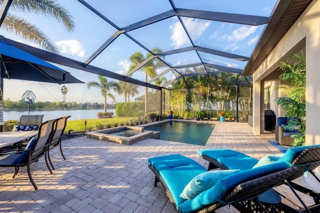 view of swimming pool with a patio, a water view, and a lanai