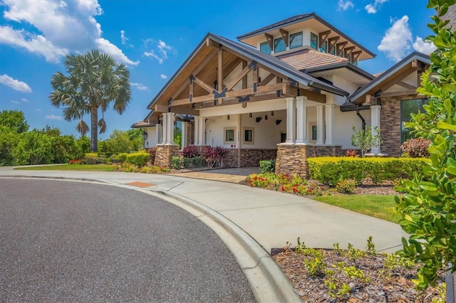 view of front of home with stucco siding and stone siding