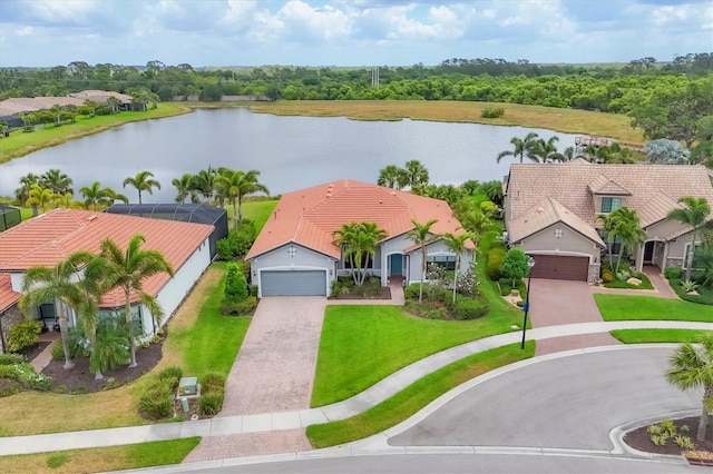 birds eye view of property with a water view