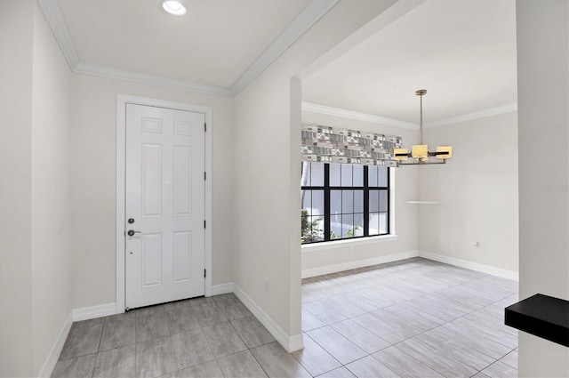 entryway with crown molding, baseboards, an inviting chandelier, and light tile patterned floors