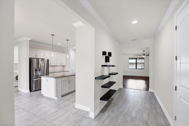 hallway featuring washer / clothes dryer, recessed lighting, baseboards, and ornamental molding