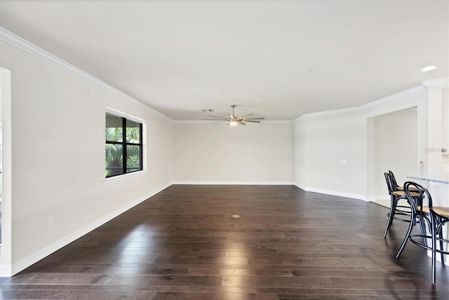 unfurnished living room with crown molding, baseboards, a ceiling fan, and dark wood-style floors
