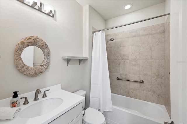 full bath featuring vanity, shower / bath combo, and toilet