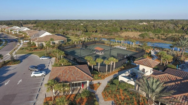 aerial view featuring a water view and a view of trees