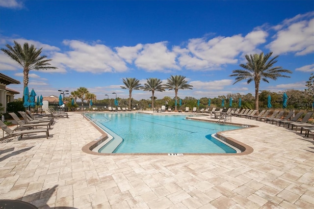 community pool with a patio