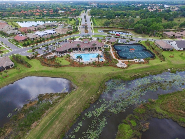 birds eye view of property featuring a water view and a residential view