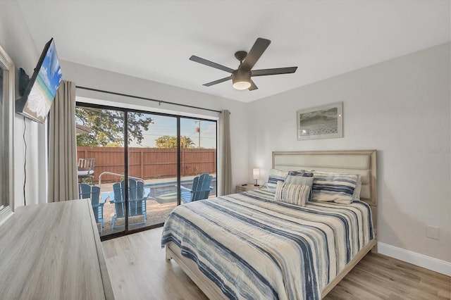 2301 Cass St, Sarasota, FL 34231 - bedroom featuring access to outside, baseboards, ceiling fan, and wood finished floors