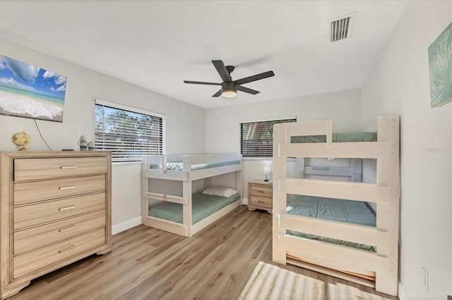 2301 Cass St, Sarasota, FL 34231 - bedroom with visible vents, baseboards, ceiling fan, and wood finished floors