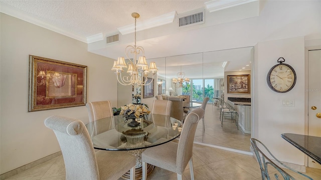 1212 Benjamin Franklin Dr Unit 503, Sarasota, FL 34236 - dining space featuring light tile patterned floors, baseboards, visible vents, and an inviting chandelier