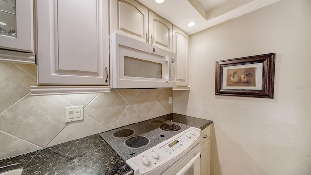 1212 Benjamin Franklin Dr Unit 503, Sarasota, FL 34236 - kitchen featuring white appliances, recessed lighting, decorative backsplash, and cream cabinetry