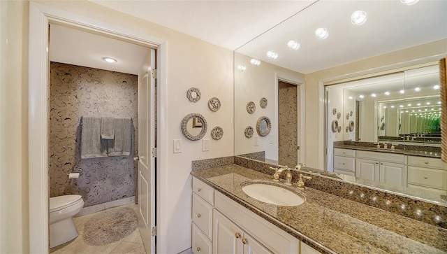 1212 Benjamin Franklin Dr Unit 503, Sarasota, FL 34236 - bathroom with tile patterned flooring, toilet, and vanity