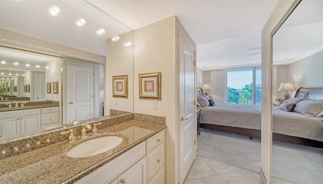 1212 Benjamin Franklin Dr Unit 503, Sarasota, FL 34236 - ensuite bathroom with tile patterned flooring, a sink, ensuite bath, and two vanities
