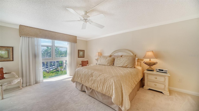 1212 Benjamin Franklin Dr Unit 503, Sarasota, FL 34236 - bedroom featuring a textured ceiling, ornamental molding, baseboards, and light carpet