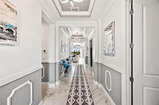 10819 Wicker Park Pl, Palmetto, FL 34221 - hall with visible vents, marble finish floor, a raised ceiling, and crown molding