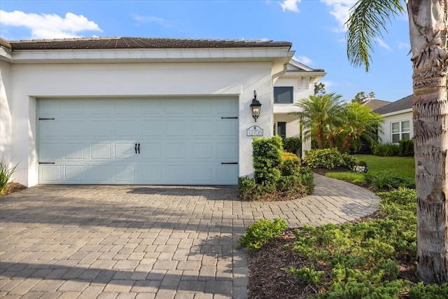 exterior space featuring decorative driveway