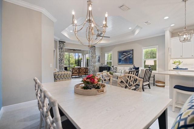 dining space with visible vents, a wealth of natural light, and an inviting chandelier
