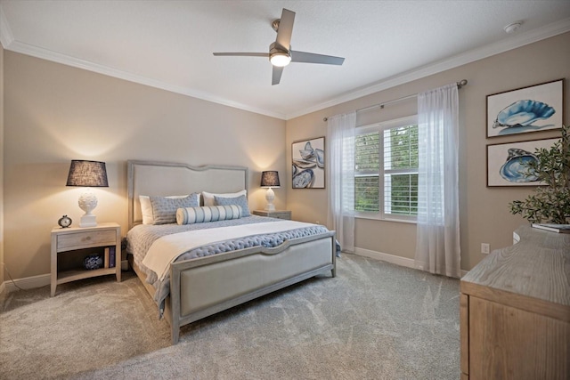 bedroom featuring baseboards, ornamental molding, carpet, and a ceiling fan
