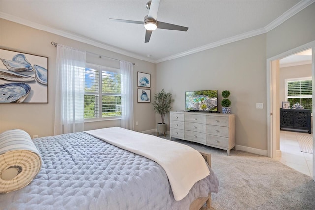 carpeted bedroom with crown molding, baseboards, and multiple windows