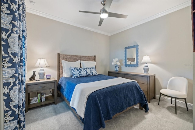 bedroom featuring baseboards, ornamental molding, a ceiling fan, and carpet flooring