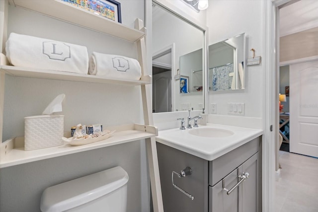 bathroom with vanity and toilet