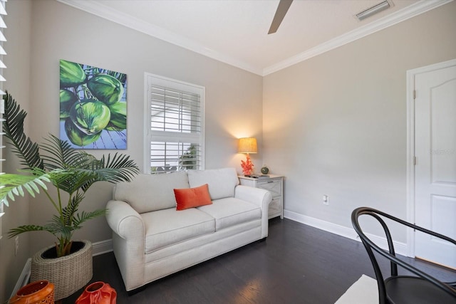 living room with crown molding, ceiling fan, dark wood finished floors, baseboards, and visible vents
