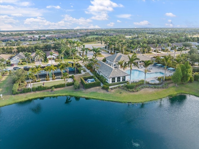 drone / aerial view featuring a water view and a residential view
