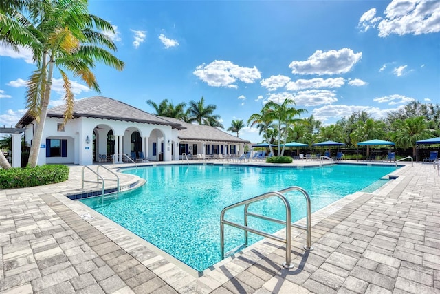 community pool with a patio area