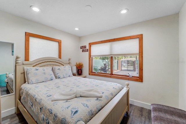 bedroom featuring recessed lighting, baseboards, and dark wood finished floors