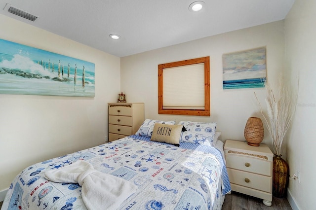 bedroom featuring recessed lighting, baseboards, visible vents, and wood finished floors