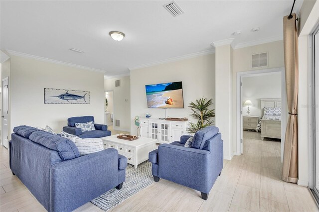 living area with visible vents and ornamental molding