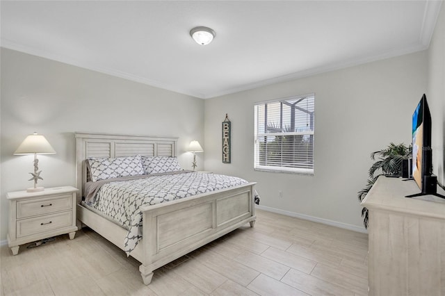 bedroom with baseboards and ornamental molding