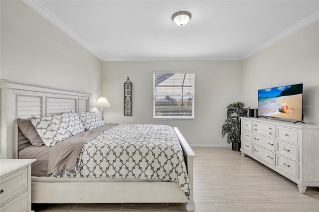 bedroom featuring baseboards and ornamental molding