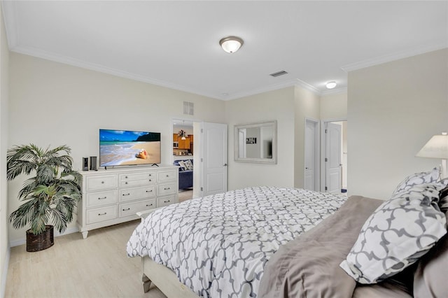 bedroom featuring crown molding and visible vents