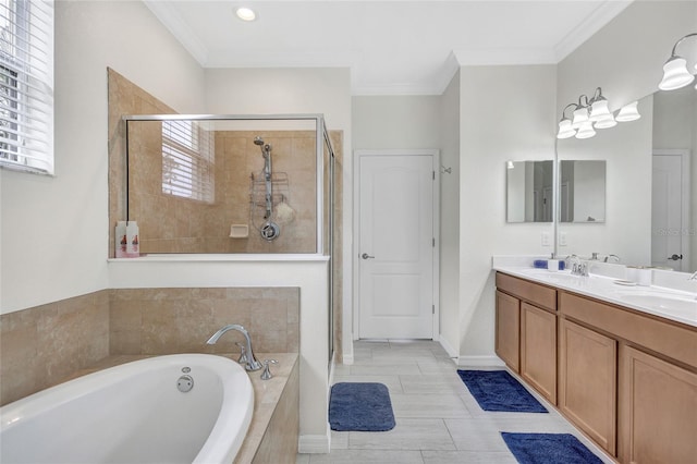 full bathroom with double vanity, ornamental molding, a bath, a shower stall, and a sink