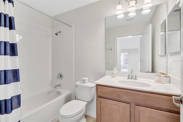 bathroom with vanity, visible vents, an inviting chandelier, toilet, and shower / tub combo