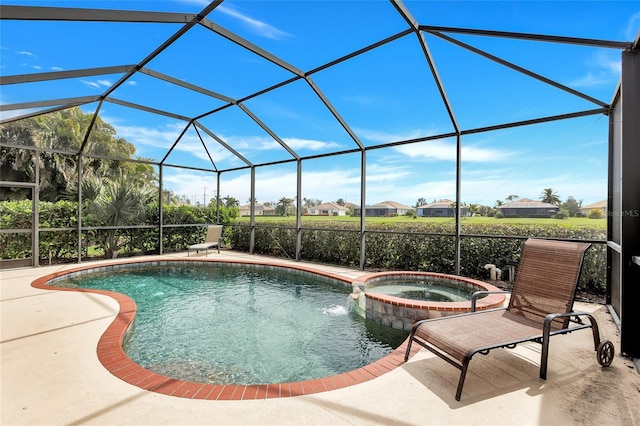 view of pool with a patio, a lanai, a pool with connected hot tub, and a residential view