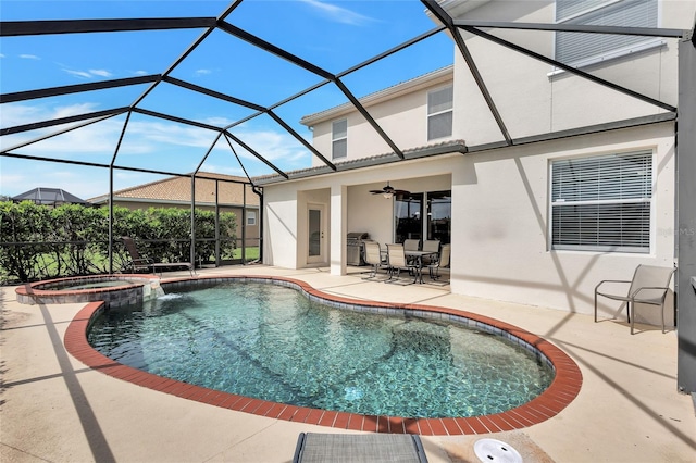 view of swimming pool with a patio, a ceiling fan, a lanai, a pool with connected hot tub, and outdoor dining space
