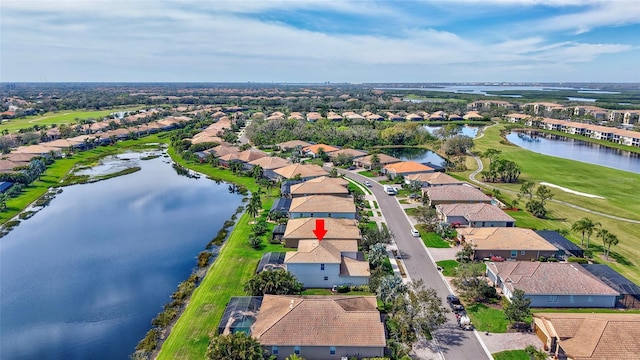 birds eye view of property featuring a water view, golf course view, and a residential view