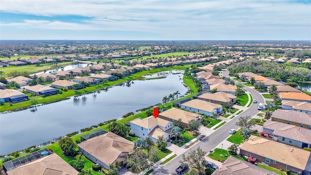 bird's eye view with a water view and a residential view