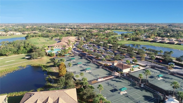 aerial view featuring a residential view, view of golf course, and a water view