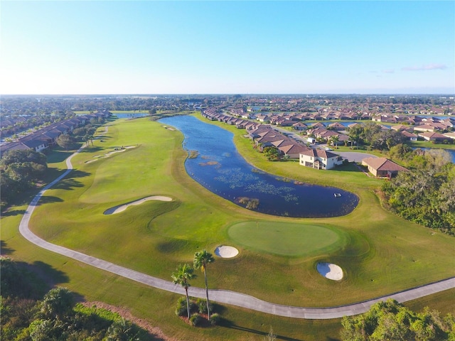bird's eye view featuring a residential view, view of golf course, and a water view