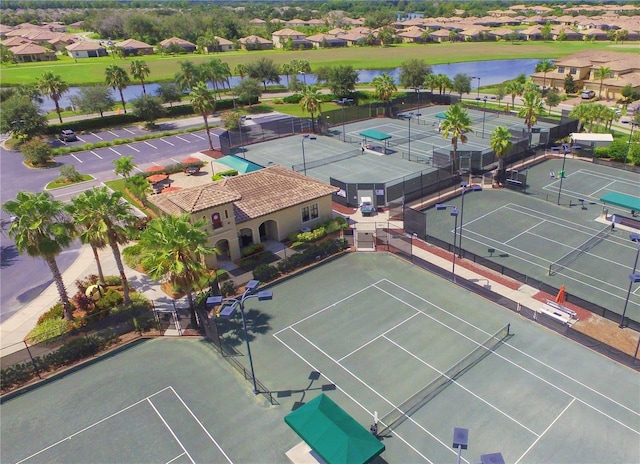 birds eye view of property featuring a water view and a residential view