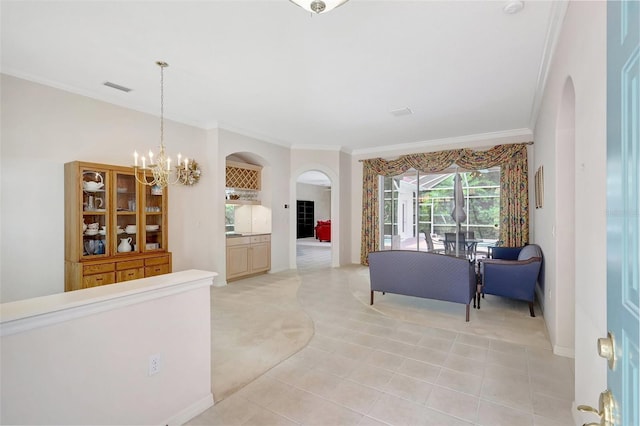 4730 Old Farm Rd, Sarasota, FL 34233 - living area featuring crown molding, arched walkways, an inviting chandelier, and light colored carpet