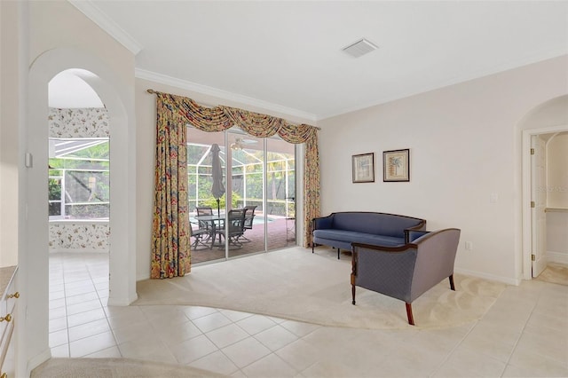 4730 Old Farm Rd, Sarasota, FL 34233 - living area featuring crown molding, arched walkways, and light tile patterned flooring