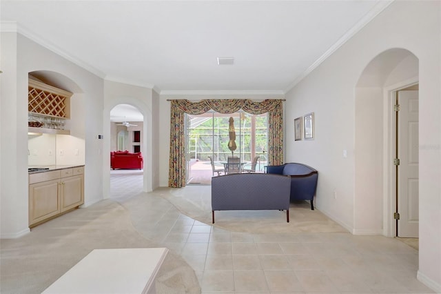 4730 Old Farm Rd, Sarasota, FL 34233 - living room with arched walkways, light colored carpet, ornamental molding, and visible vents